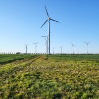 Backlit modern wind turbines